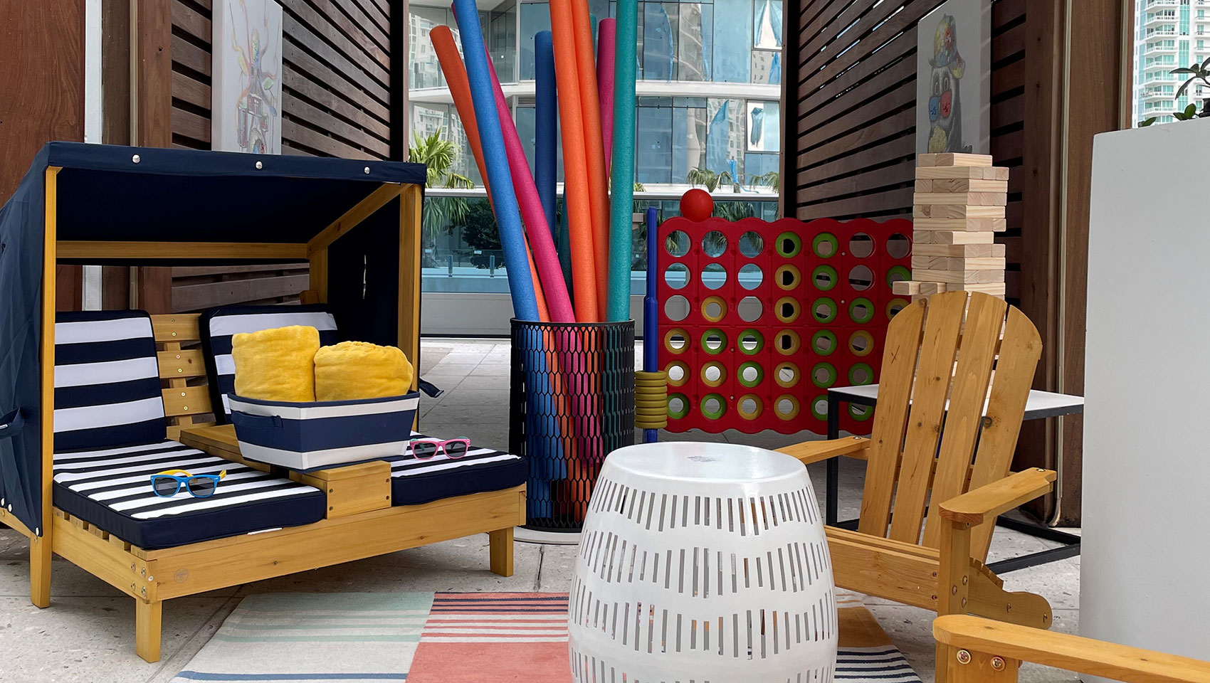 cabana with pool noodles, seats and towels
